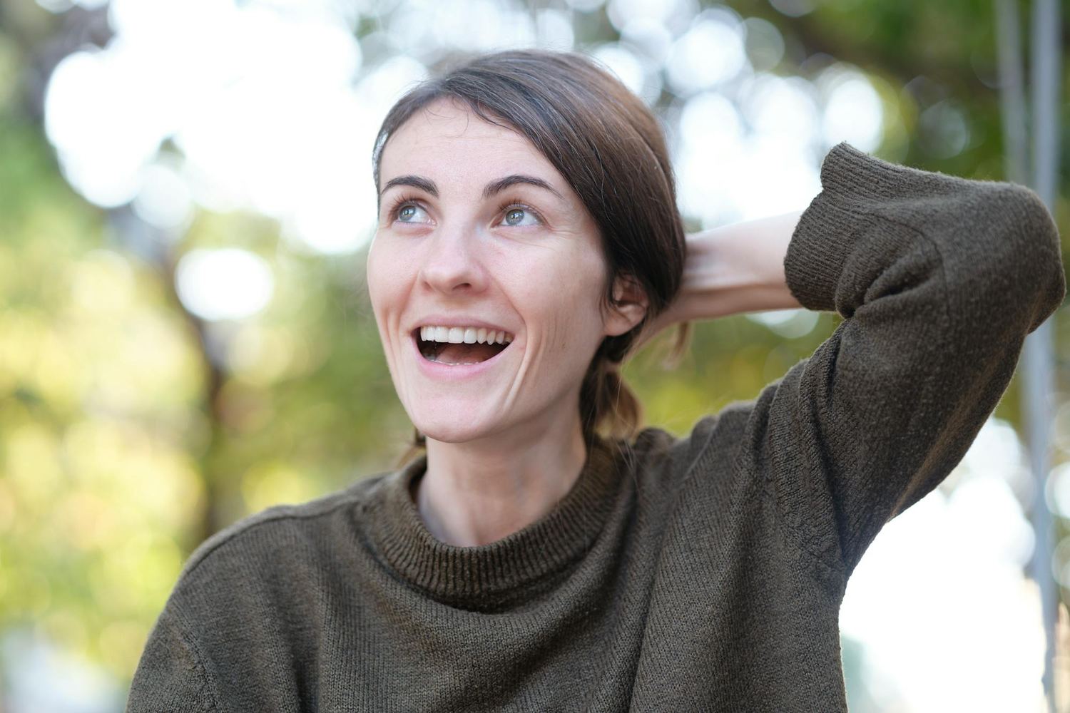 Woman smiling with relief and hope, reflecting recovery through psychiatric care at Ascend Mind and Body.